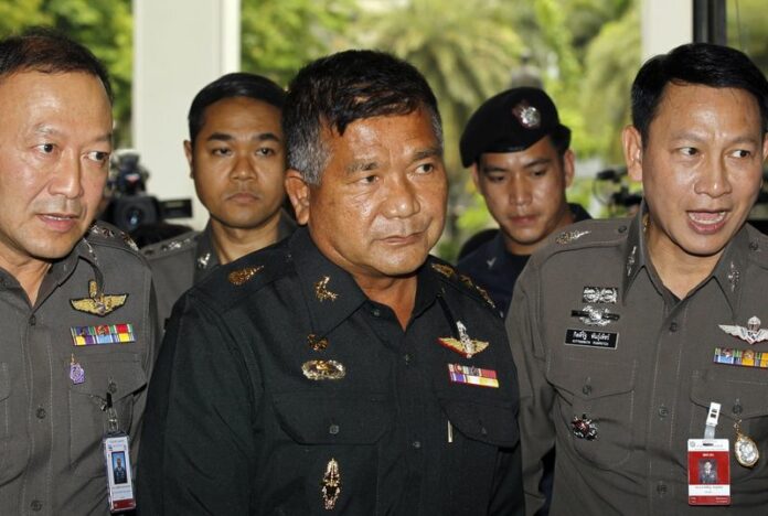 Army Gen. Manas Kongpaen, at center, was implicated by authorities in human trafficking in Thailand. Photo: DPA