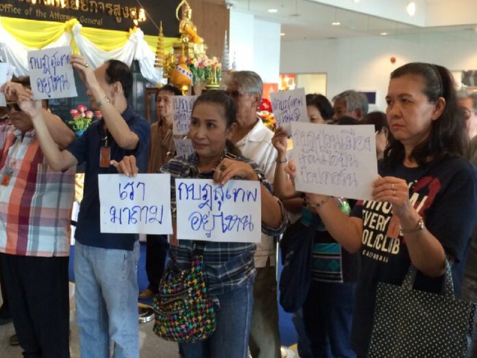 Redshirt supporters at the Office of the Attorney General in Bangkok today call for an explanation of why charges have languished against leaders of the former anti-government movement.