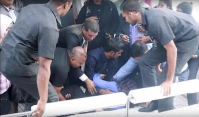 Security personnel aid the injured in a still image from video released of the Sept. 28 incident in which a speedboat carrying Maldives' president exploded as it entered port in the capital of Male.
