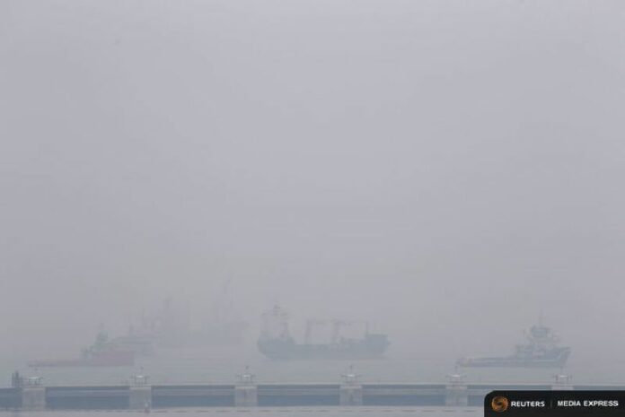 Vessels line the anchorage area in the southern coast of Singapore on Monday. Photo: Reuters / Edgar Su