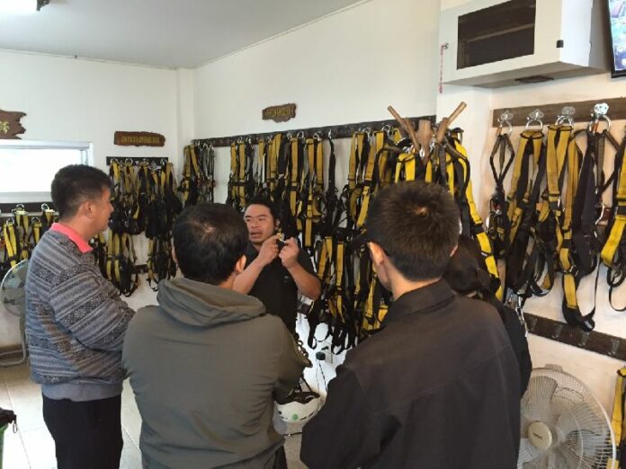Police inspect equipment at Flying Squirrels zipline adventure in Chiang Mai province.