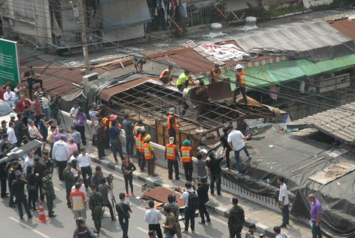 Workers today began dismantling structures near the Saphan Lek market in Bangkok's Chinatown area.