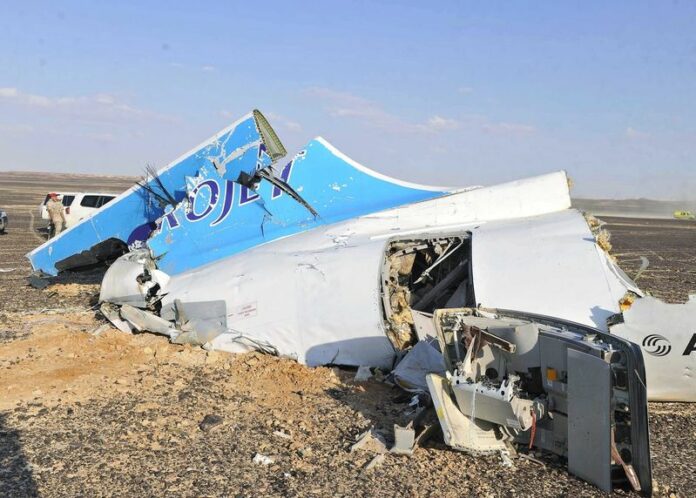 Debris from the crashed Russian passenger jet lies strewn Saturday across the sand in Sinai, Egypt. Photo: EPA<br />