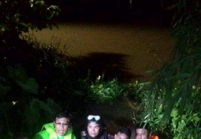 Four rescue workers recover the body of a man who drowned after jumping into a canal to fulfill a spiritual pact he'd made in the event his wife was pregnant with a boy.