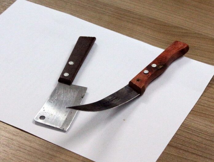 Two knives found by police on Pvt. Santirat Raksaphakdee upon his arrest Thursday night on Pattaya's Walking Street.