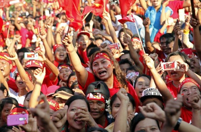 Supporters of the National League for Democracy party cheer at an Oct. 28 campaign rally in Mandalay, Myanmar. Photo: EPA / Hein Htet