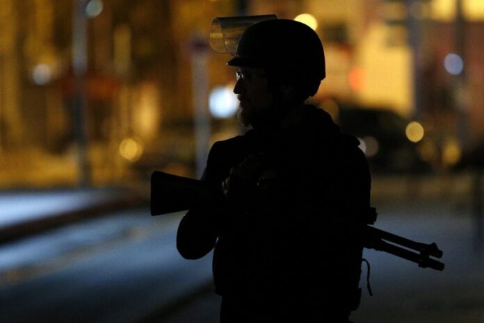 A member of the French police participates in a police operation today in the city center of Saint Denis, near Paris, France. Photo: EPA / Yoan Valat<br />