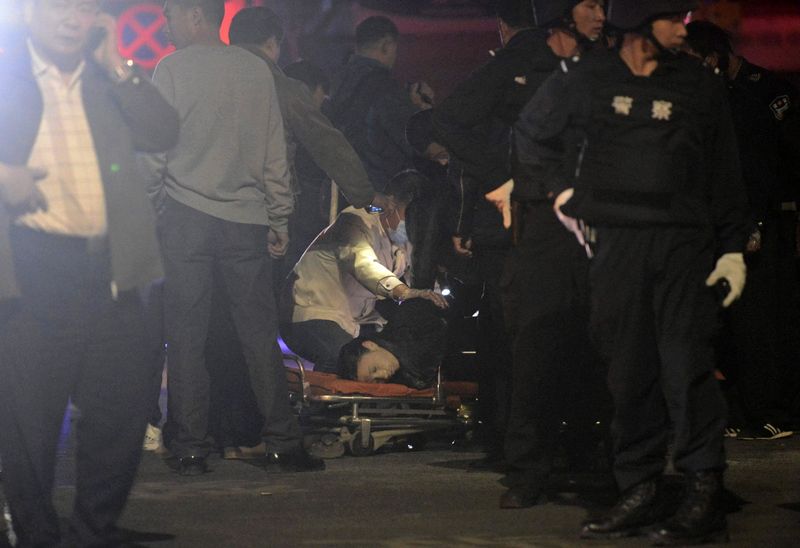 A file photo of a victim being examined after a deadly attack by a group of knife-wielding men in Kunming, in southwest China's Yunnan province on March 2, 2014. Chinese police killed 17 people, including suspects who were allegedly responsible for a deadly terrorist knife attack in the Xinjiang region in September. Photo: EPA / Sui Shui
