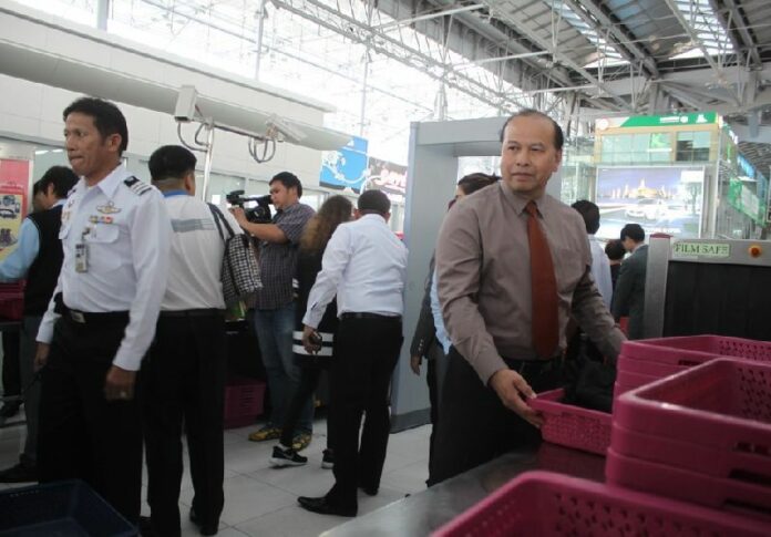 Airport staff demonstrate security protocols June 25 at Suvarnabhumi Airport in Bangkok.