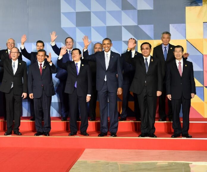 US President Barack Obama and junta chairman Prayuth Chan-ocha during group photo at APEC summit today.