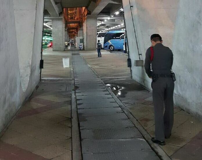 An officer investigates the scene where a British national fell to his death early this morning in an apparent suicide.<br />