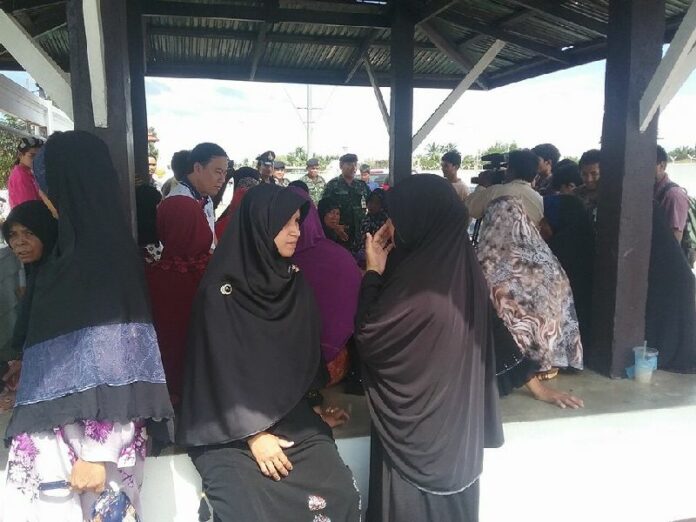 Family and relatives of Abdullayib Dolah, 42, gathered Friday morning at the Inkayuth army base to hear news about his death.