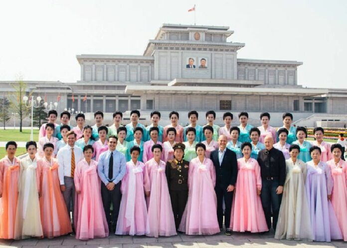 The author, front row fourth from left, is welcomed during a 2014 visit to Pyongyang, North Korea.