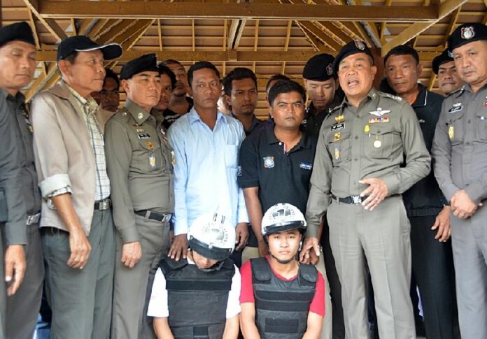 In this Oct. 3, 2014, file photo, police presented Zaw Lin and Wai Phyo to a crowd of reporters on Tao island.