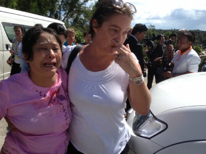 Mother of zaw lin is escorted away from the courthouse after the verdict Dec. 24