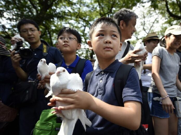 A tribute to the war dead during a ceremony at the controversial Yasukuni Shrine precinct in Tokyo, on Aug. 15, the day of the 70th anniversary of the end of World War II. Photo: Franck Robichon / EPA