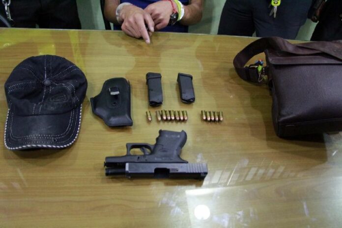 The firearm and ammunition confiscated from the Chinese tourist.