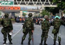 Royal Thai Army Writing Manuals to Handle Protests In this May 14, 2010, file photo, soldiers face off with Redshirt protesters on Rama IV Road in Bangkok.