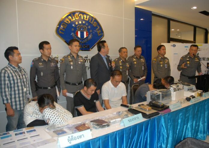 Five Chinese who were arrested for buying gold with fake credit cards and possession of false passports, appear at the Crime Suppression Division in Bangkok yesterday.