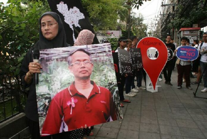 Activists mark the 11th anniversary of the abduction of human rights lawyer Somchai Neelapaijit in 2015 in Bangkok.