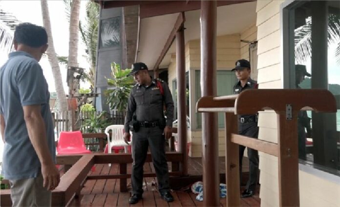 Police investigate the scene Wednesday where gunfire hit rooms in which tourists were sleeping the day before at Palita Lodge on Haad Rin Nok, Koh Phangan.