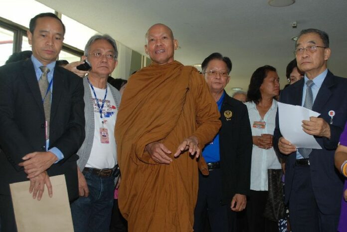 Firebrand monk Buddha Issara, center, in a June 2015 file photo.
