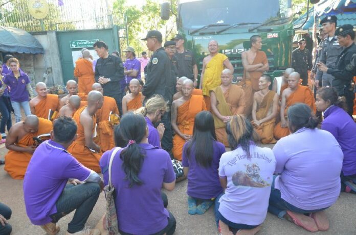 Monks and volunteers block government vehicles in April 2015 from leaving a commercial wildlife center operating as a temple in Kanchanaburi province.