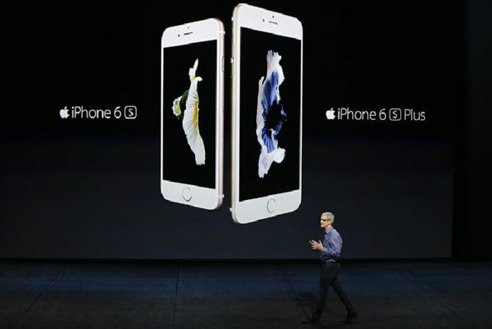 Apple CEO Tim Cook discusses the new iPhone 6s and iPhone 6s Plus during an Apple event in San Francisco in a Sept. 9, 2015, file photo.Photo: Eric Risberg / Associated Press