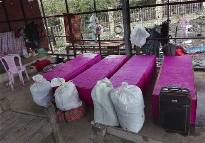 Coffins of landslide victims are kept Wednesday in Hpakant hospital morgue in northern Kachin State, Myanmar. Photo: Pan Aung / AP