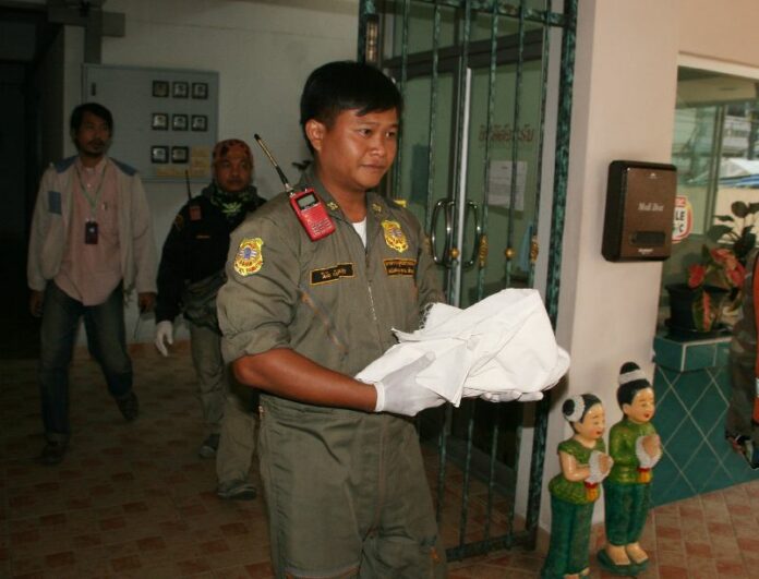 A rescue worker carries Wednesday the body of 4-year-old chihuahua ‘Dehlee’