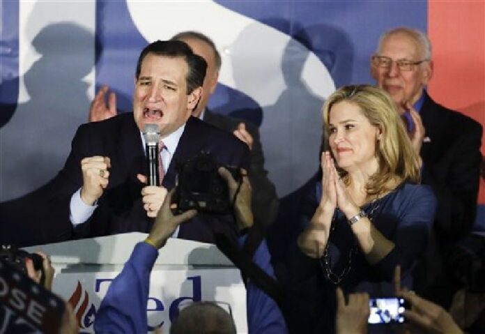 Republican presidential candidate, Sen. Ted Cruz, Republican of Texas, speaks at a rally Monday as his wife Heidi listens in Des Moines, Iowa. Photo: Chris Carlson / Associated Press<br />