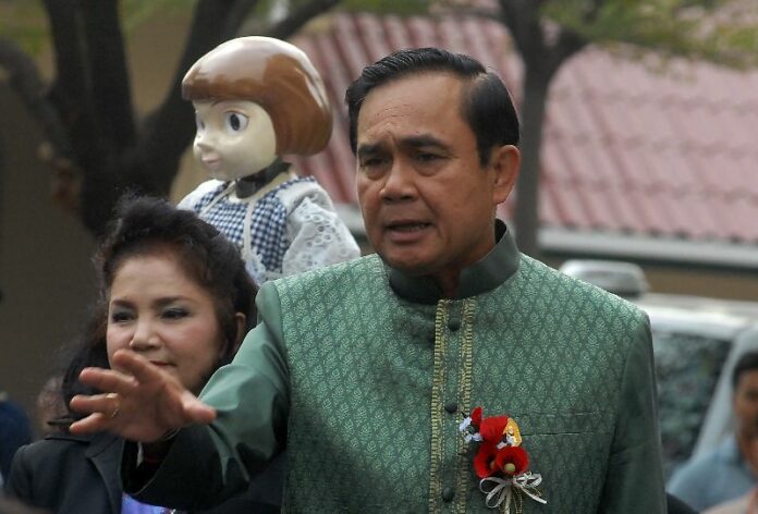 Junta chairman Prayuth Chan-ocha speaks to reporters Tuesday at Government House in Bangkok.