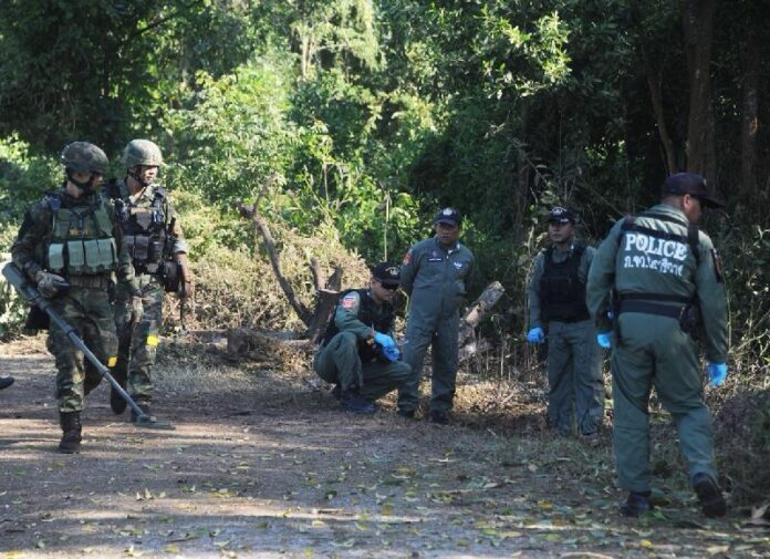 Security forces investigate the site of a bomb attack Jan. 12 in Narathiwat province.