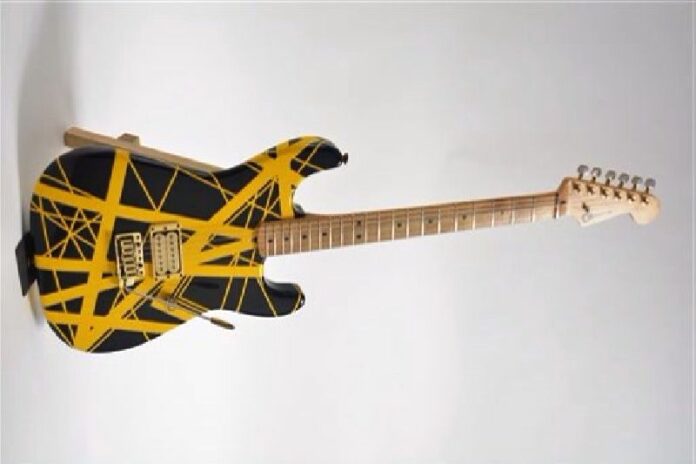 This undated photo provided by Guernsey’s auction house shows a yellow-and-black Charvel guitar, customized for Eddie Van Halen in the 1980s It could bring $60,000 to $80,000 when it goes up for sale on Feb. 27, 2016, in New York. Photo: Guernsey's / AP