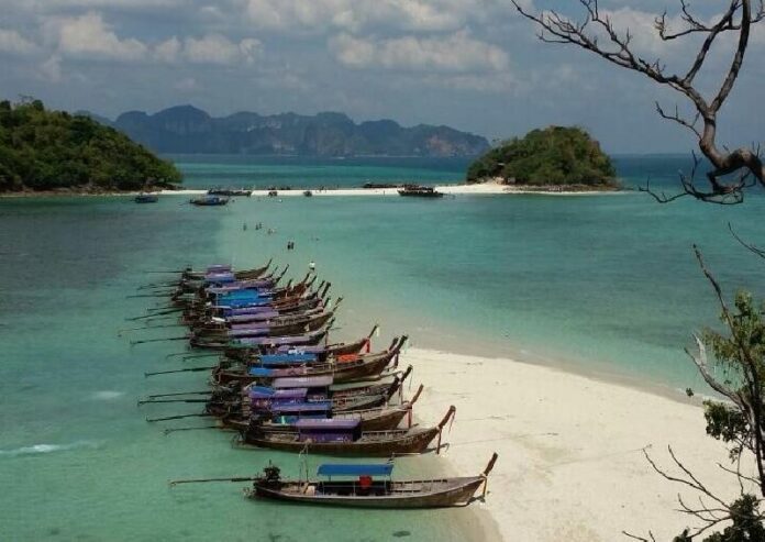 Long-tail boats docked at a beach Friday on Koh Talay Waek in Krabi province.