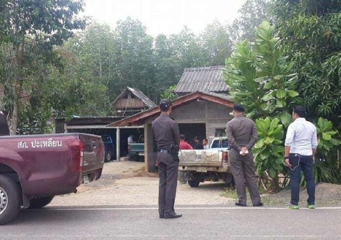 Officers surrounding Pornpichit’s house in Trang’s Palian district.