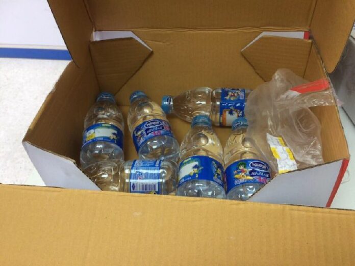 Box of water bottles deputy mayor Narawuth Kunakham said he received, instead of the guitar he ordered online.
