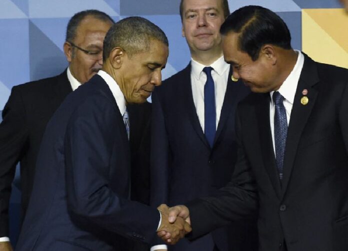 President Barack Obama shakes hands with Prime Minister Prayuth Chan-ocha on Nov. 19, 2015, in Manila, Philippines. When Obama welcomes Southeast Asian leaders for a shirt-sleeves summit in California this week, he’ll have some interesting dining companions. There will be a coup leader with a penchant for song, a sultan with a taste for the high life and a ruthless prime minister with 31 years on the job. Photo: Susan Walsh / Associated Press<br />