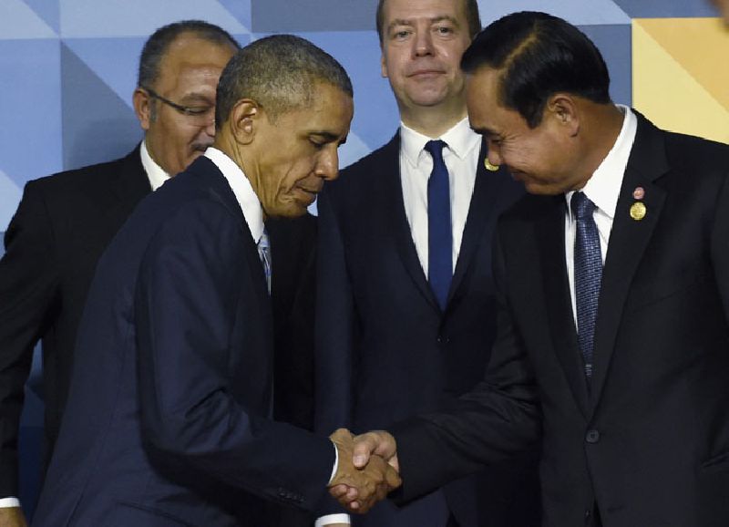 President Barack Obama shakes hands with Prime Minister Prayuth Chan-ocha on Nov. 19, 2015, in Manila, Philippines. When Obama welcomes Southeast Asian leaders for a shirt-sleeves summit in California this week, he’ll have some interesting dining companions. There will be a coup leader with a penchant for song, a sultan with a taste for the high life and a ruthless prime minister with 31 years on the job. Photo: Susan Walsh / Associated Press<br />