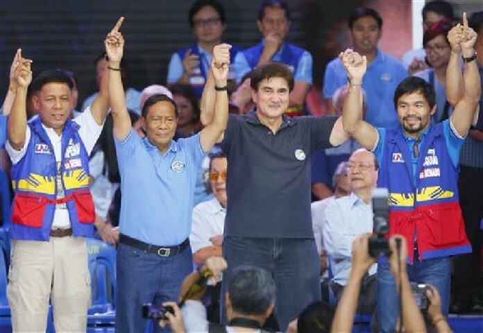 Filipino boxer and Congressman Manny Pacquiao, right, at the start of the official campaign period for the May 9, 2016 presidential elections at suburban Mandaluyong city east of Manila, Philippines Tuesday, Feb. 9, 2016. Photo: Bullit Marquez / Associated Press