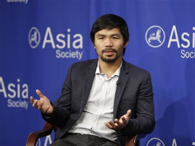 In this Oct. 12, 2015, file photo, Manny Pacquiao takes questions at the Asia Society in New York