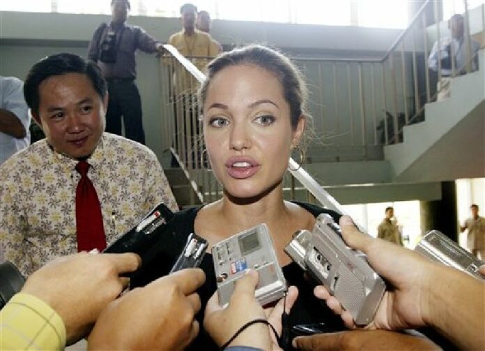 In this July 6, 2014, file photo, actress Angelina Jolie Pitt speaks to Cambodian reporters during a visit to Phnom Penh, Cambodia. Photo: Andy Eames / Associated Press