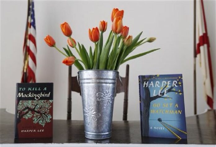 Harper Lee's two books, "To Kill a Mockingbird," and "Go Set A Watchman" are displayed with a bouquet of tulips in the Monroe County Heritage Museum old courthouse Friday, Feb. 19, 2016, in Monroeville, Ala. Photo: Brynn Anderson / Associated Press