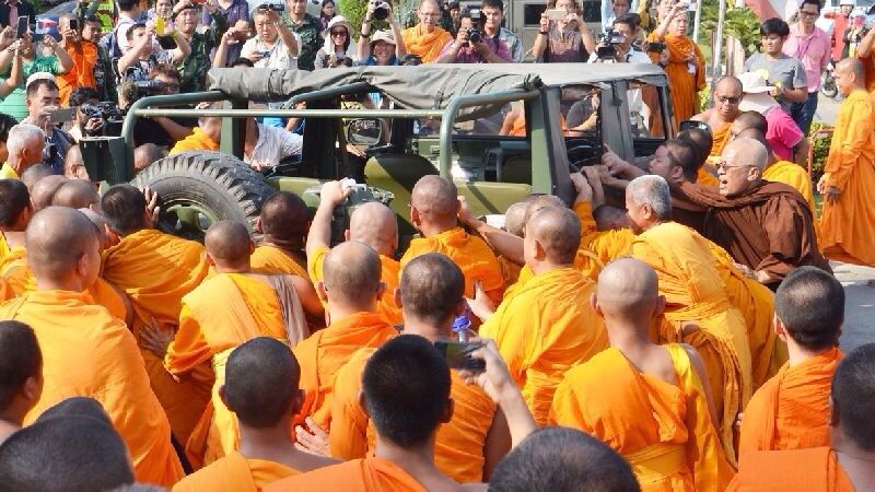 Hundreds of monks scuffle with soldiers and try to forcibly remove vehicles blocking their way Feb.15 at a Buddhism park west of Bangkok.  