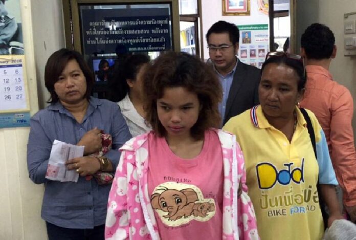 Pailin Kiangkwa, at center, says she could not have written allegedly defamatory messages online because she has been blind for eight years.