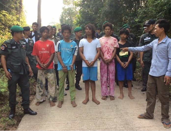 Five Cambodian nationals accused of assaulting a group of French tourists and raping two women are led through a ‘re-enactment’ of their alleged crimes Monday on Koh Kut in Trat province.