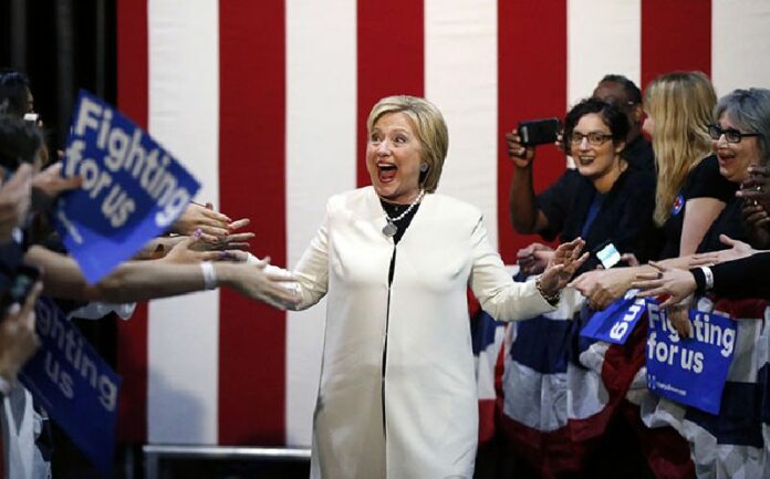 Democratic presidential candidate Hillary Clinton reacts to supporters as she arrives to her Super Tuesday election night rally in Miami, Florida. Photo: Gerald Herbert / Associated Press