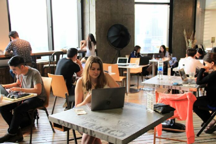 Numerous expats work at a cafe at the Thailand Creative & Design Center in Bangkok. Foreign