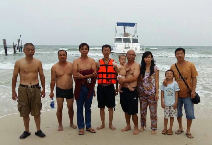 Nine Chinese asylum seekers were taken by officials Wednesday back to the beach in Chumphon province where their boat foundered the night before. Photo: Courtesy Lisa Zhang