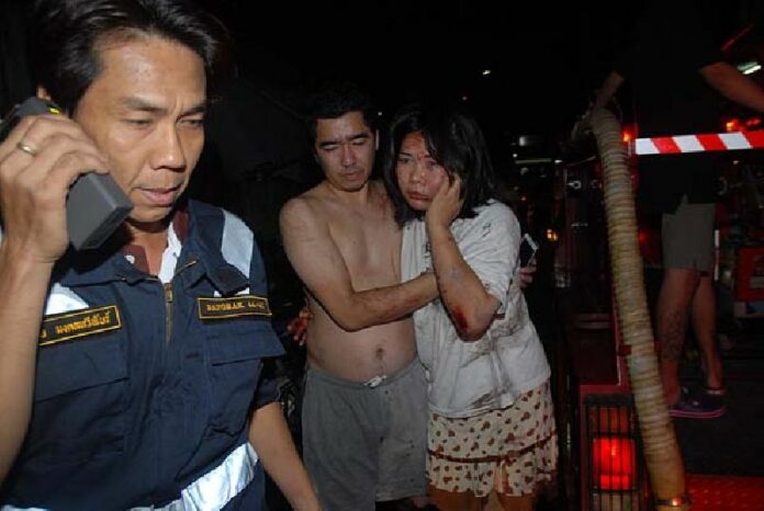 Residents are rescued from the burning Royal Court Apartment Early Monday morning.<br />